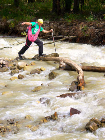 Tourist crossing the riverの写真素材