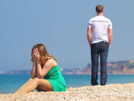 Crying girl on the beachの写真素材