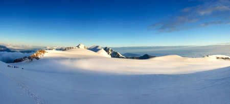 Panorama of the snowy mountain valleyの写真素材
