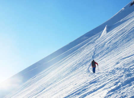 Tourist on the snowy hillの写真素材
