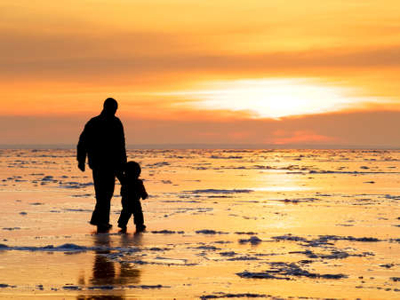 Silhouettes of a father and son  Concept and ideaの写真素材