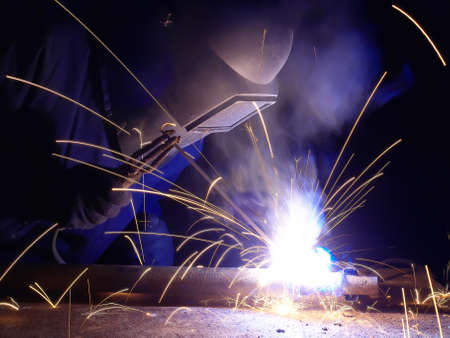 Welder on the industrial workplace
