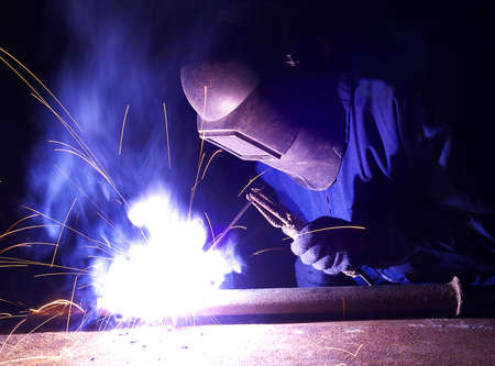 Welder on the industrial workplace