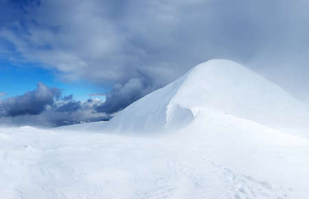 Snowy mountains during stormの写真素材