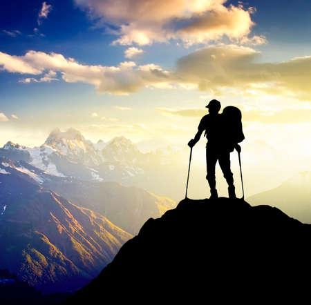 Sillhouette of a tourist on the high mountain. Sport and active lifeの写真素材