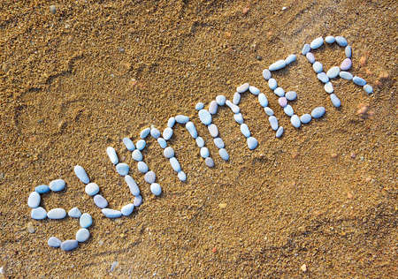 Text from pebbles on beach 