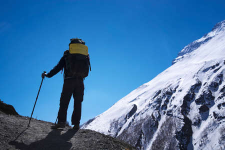 Silhouette of tourist in mountains. Sport and active life conceptの写真素材