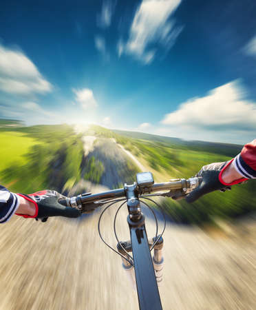 Fast ride on mountain rocks. Sport and active life conceptの写真素材