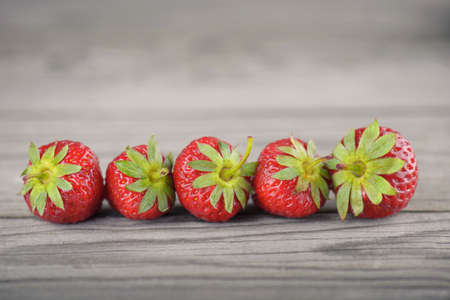 Strawberry on old wood background. Healthy and tasty foodの写真素材