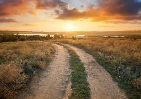 Rural road on the mountain hill. Beautiful natural landscape