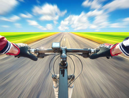 Ride on bycycle on road. Sport and active life conceptの写真素材