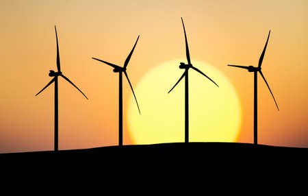 Silhouette of a wind power station. Industrial and technological concept