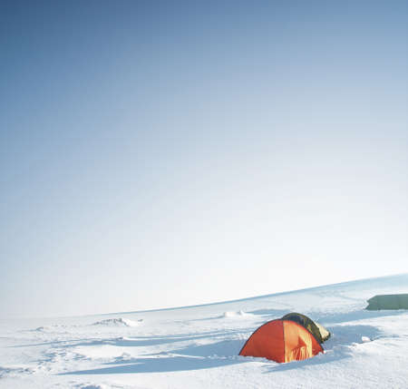 Camp on snow plane in the mountain valley. Active life conceptの写真素材
