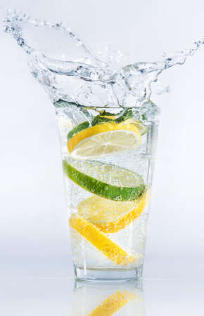 Lemons and limes in the glass. Concept and idea of drinkの写真素材