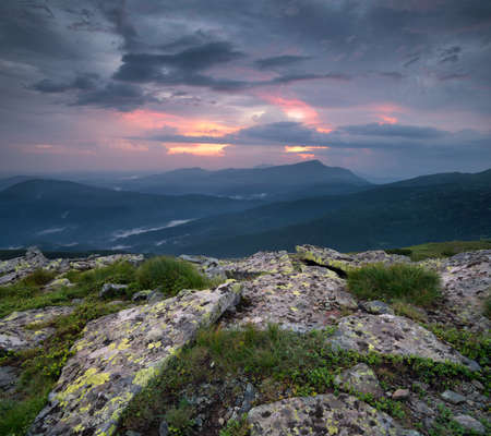 Mountain panorama during sundown. Beautiful natural panoramic landscape in the summer timeの写真素材