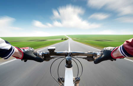 Ride on bycycle on road. Sport and active life conceptの写真素材