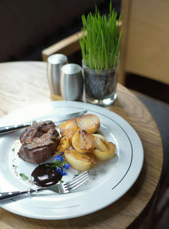 Steak and grill onion as a dinner background. Concept and idea of tasty foodの写真素材