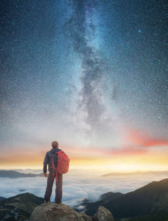 Silhouette of a champion on mountain peak. Active life conceptの写真素材