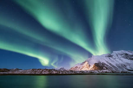 Northen light under mountains. Beautiful natural landscape in the Norwayの写真素材