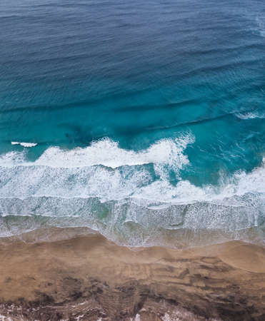 Aerial view on the beach and waves. Beautiful natural landscape from airの写真素材