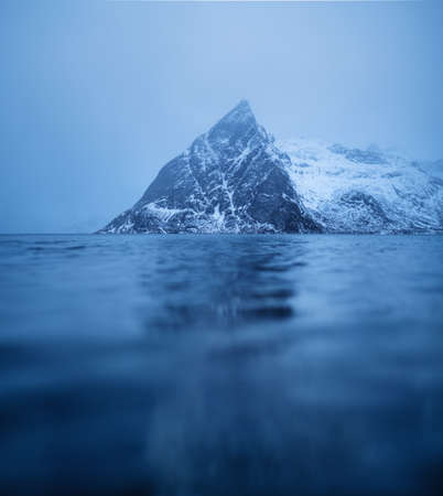 Mountains reflection on water surface. Beautiful natural landscape in the Norway