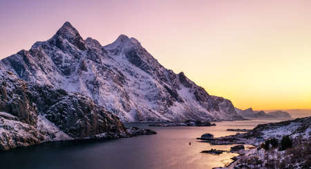 Mountain peak and sea bay during sunrise. Natural landscape in the Norwayの写真素材