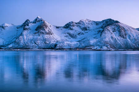 Mountain ridge and reflection in the lake. Natural landscape in the Norwayの写真素材