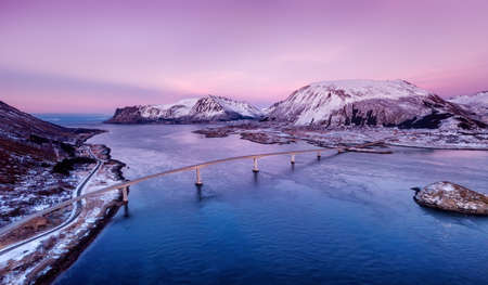 Bridge and high mountains during sunset. Natural landscape in the Norwayの写真素材