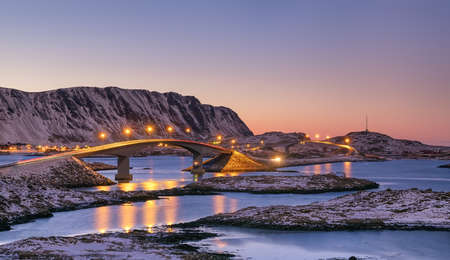 Bridge and high mountains during sunset. Natural landscape in the Norwayの写真素材