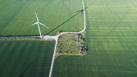 Wind power station on the field. Concept and idea of alternative energy developmentの写真素材