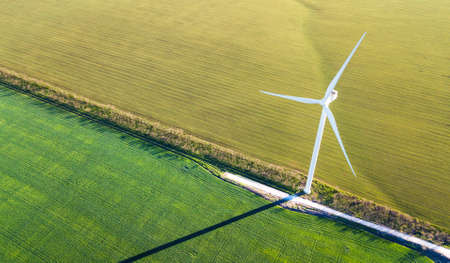 Wind power station on the field. Concept and idea of alternative energy developmentの写真素材