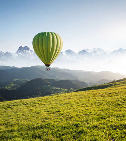 Air ballon above mountains at the summer time. Concept and idea of adventureの写真素材