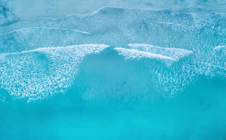 Wave on the beach as a background. Beautiful natural background at the summer time