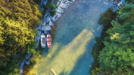 Aerial view on the lake and boats. Natural landscape from drone. Aerial landscape from air in the...