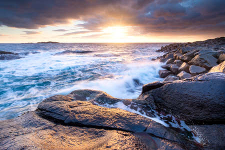 Seashore during storm, Lofoten islands, Norway. Sea coast and waves. Natural sunrise on the seashore. Seascape during sunrise.の写真素材