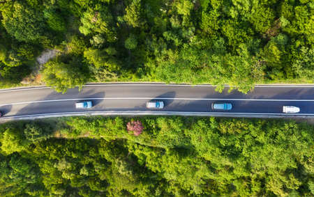 Croatia. Aerial view on road in the forest. Highway throu the forest. View from a drone. Natural landscape in summer time from air. Travel - imageの写真素材