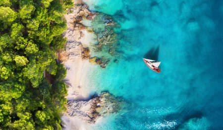 Panoramic coast and yacht as a background from top view.