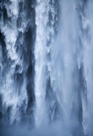 Skogafoss waterfall as a background. Natural icelandic background. Travelling on Iceland. Famouns...