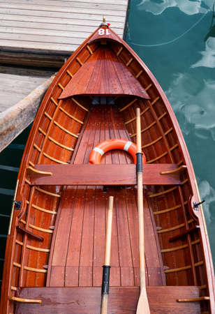 Boats and lifebuoy on the lake. Lago di Braers lake in the Dolomites alps, Italy. Beautiful...