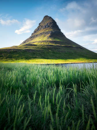 Kirkjufell. Mountains in the Iceland. High rocks and grass at the day time. Natural landscape at the summer. Iceland - imageの写真素材