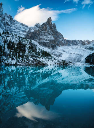Lago di Sorapis lake, Dolomite Alps, Italy. Beautiful natural landscape at the winter time. Reflections on water surface.の写真素材