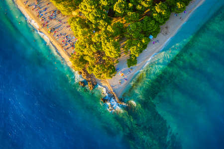 Mediterranean sea. Aerial view on the beach and people. Beach and blue water. Top view from drone at beach and azure sea. Travel and vacation imageの写真素材