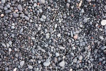 Gray pebbles as a background in the Iceland sea shore. Abstract composition. Design image.の写真素材