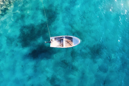Croatia. Summer. Aerial view of floating boat on blue Adriatic sea at sunny day.  Boat on sea surface. Seascape from drone. Travel and leisure.の写真素材