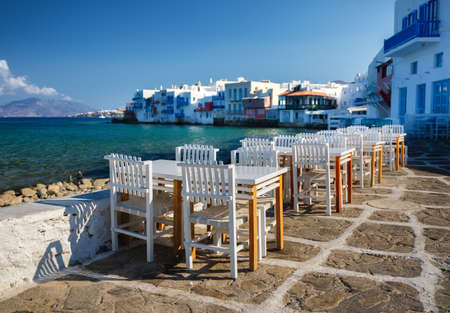 A restaurant overlooking Little Venice, Mykonos Island, Greece. Lunch and dinner overlooking the sea. Photo as wallpaper.の写真素材