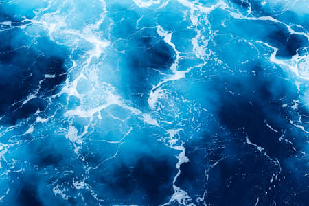 Waves and blue water as a background. View at the ocean surface. Natural summer seascape. Water background. Abstract blue ocean background.の写真素材