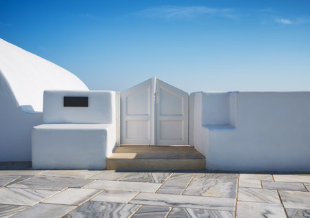 Traditional courtyard entrance in the village of Oia, Santorini, Greece. Traditional architecture. Photo as wallpaper.の写真素材