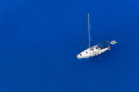 Aerial view at the yacht at the day time. Adventure and travel.  Landscape with yacht in Greece....