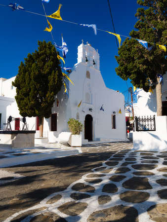 Church on the island of Mykonos, Greece. Narrow streets and traditional architecture. Photo as wallpaper.の写真素材