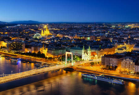View of Budapest at night, Hungary. A cityscape in Europe. Ferris wheel and ancient architecture. Bridges and the Danube River. Landscape from above.の写真素材